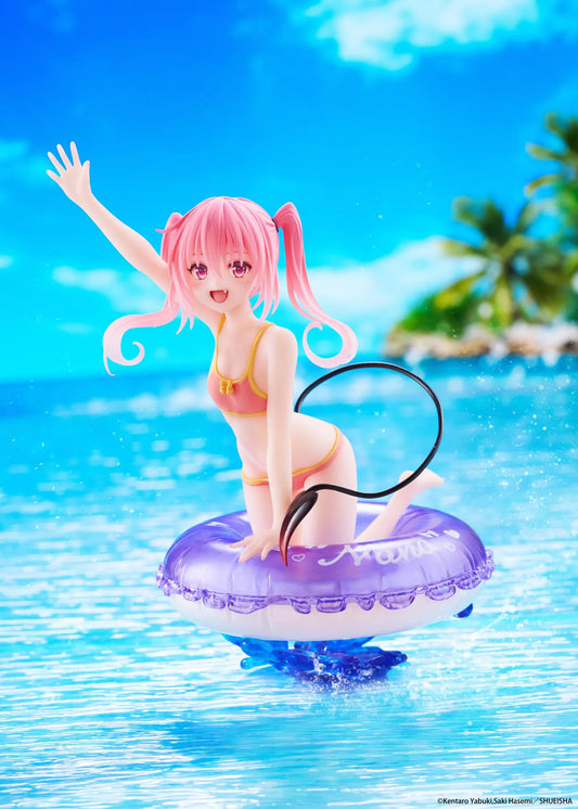 To Love-Ru Darkness Aqua Float Girls Nana figure featuring Nana with pink twin tails in a swimsuit posing on a purple float ring display base