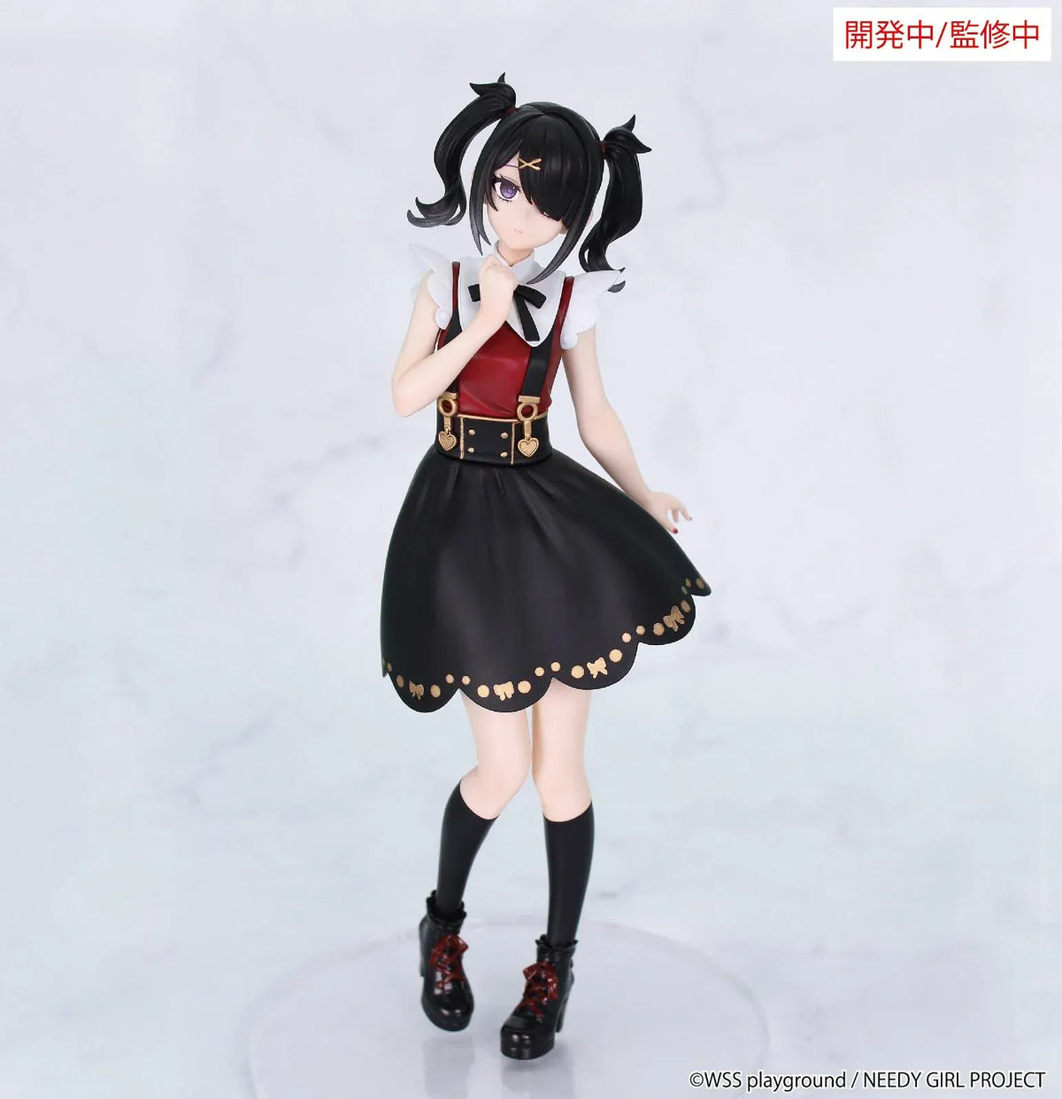 Prototype NEEDY GIRL OVERDOSE Vivit AME-CHAN figure with black twin ponytails, a red-and-black dress, gold-colored details, and platform boots.