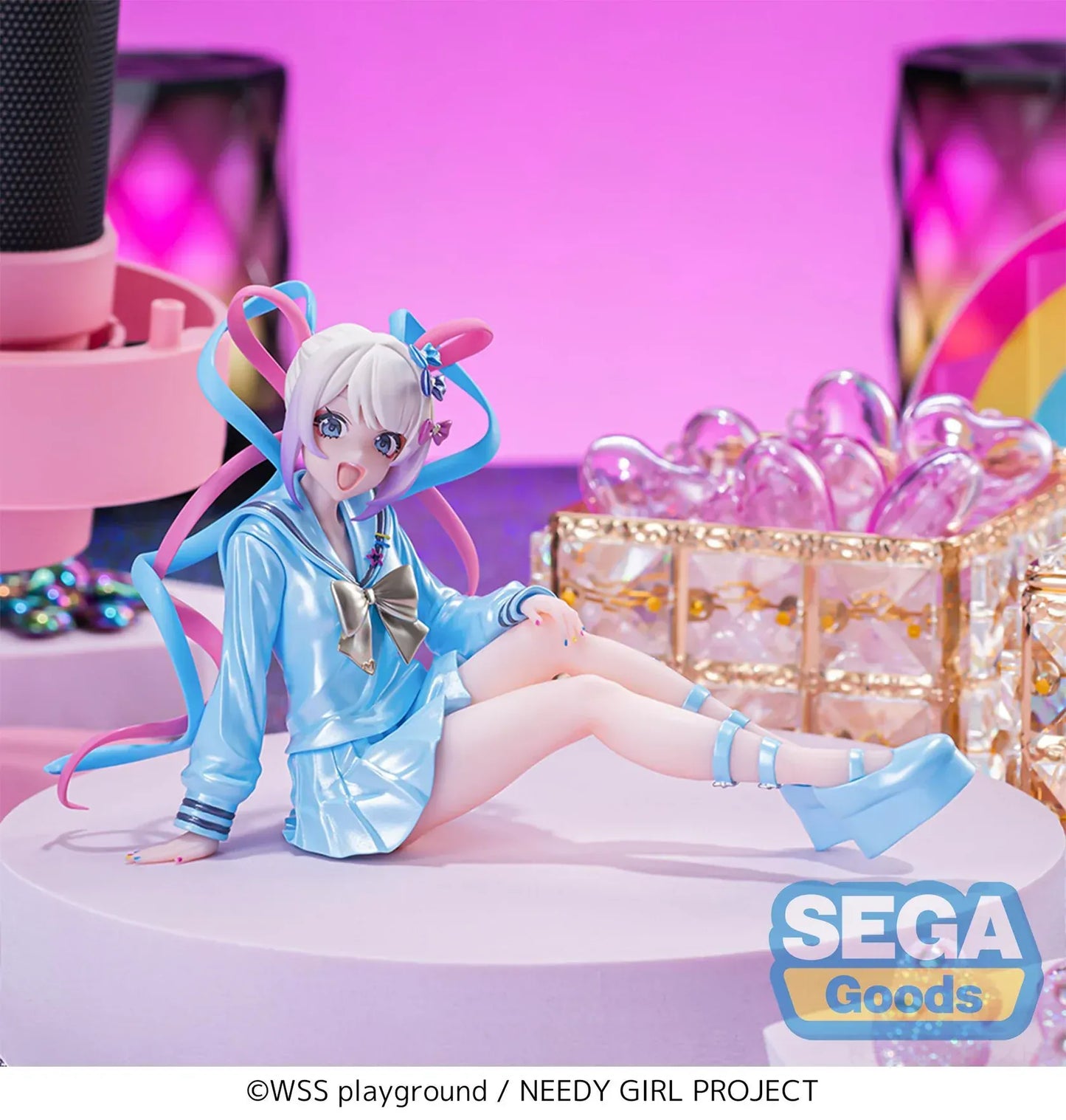 Figure of OMGKawaiiAngel sitting in a perching pose with pastel ribbons, glossy outfit, and energetic expression.