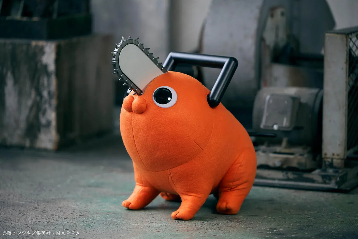 Chainsaw Man life-size Pochita doll figure with an orange body, glossy eyes, chainsaw blade, black handle, and pull cord.