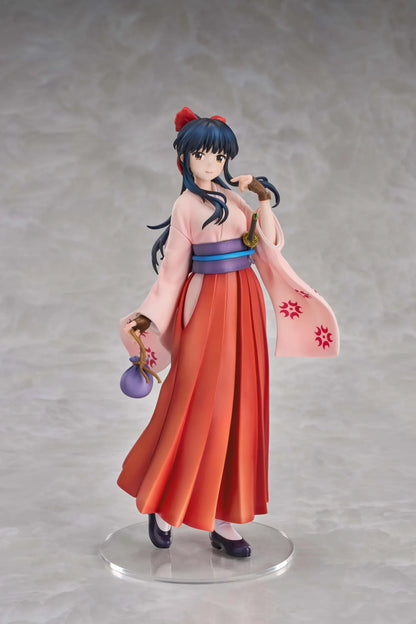 Sakura Wars Sakura Shinguji 1/7 Scale Figure featuring a dark blue-haired anime girl with brown eyes, a red hair ribbon, pink kimono-style top, purple obi, flowing red hakama skirt, sword accessory, and purple pouch on a transparent circular base.