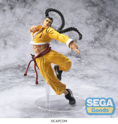 Street Fighter 6 FiGURiZMa Jamie figure in a dynamic martial arts pose with signature yellow outfit and braided hair