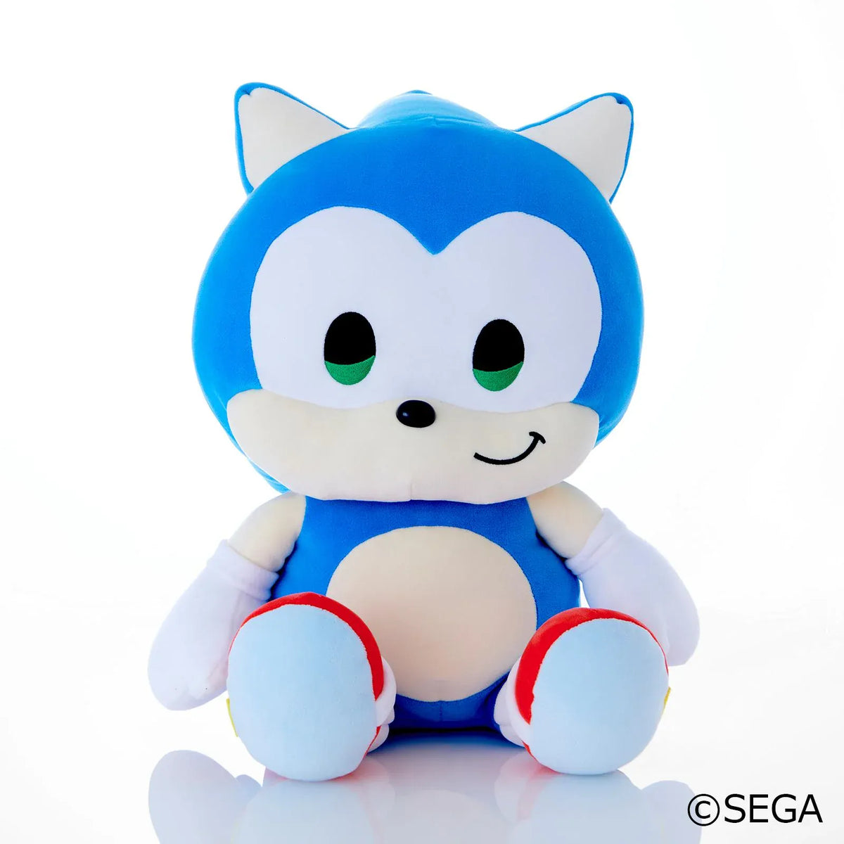 Sonic & Friends Sonic large plush with green eyes, white gloves, red shoes, and a seated pose.