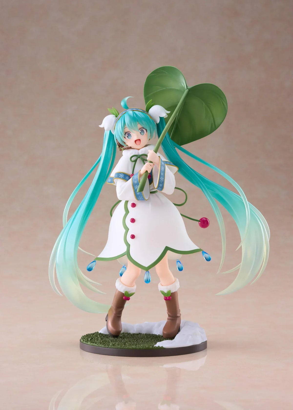 Snow Miku All Stars 2015 Ver. AMP+ figure wearing a white flower-inspired dress and holding an oversized green leaf.