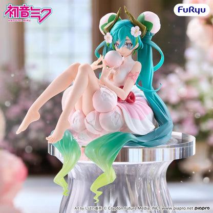 Hatsune Miku Flower Fairy White Plum Blossom Noodle Stopper figure seated among pale pink blossoms with flowing turquoise twin-tails.