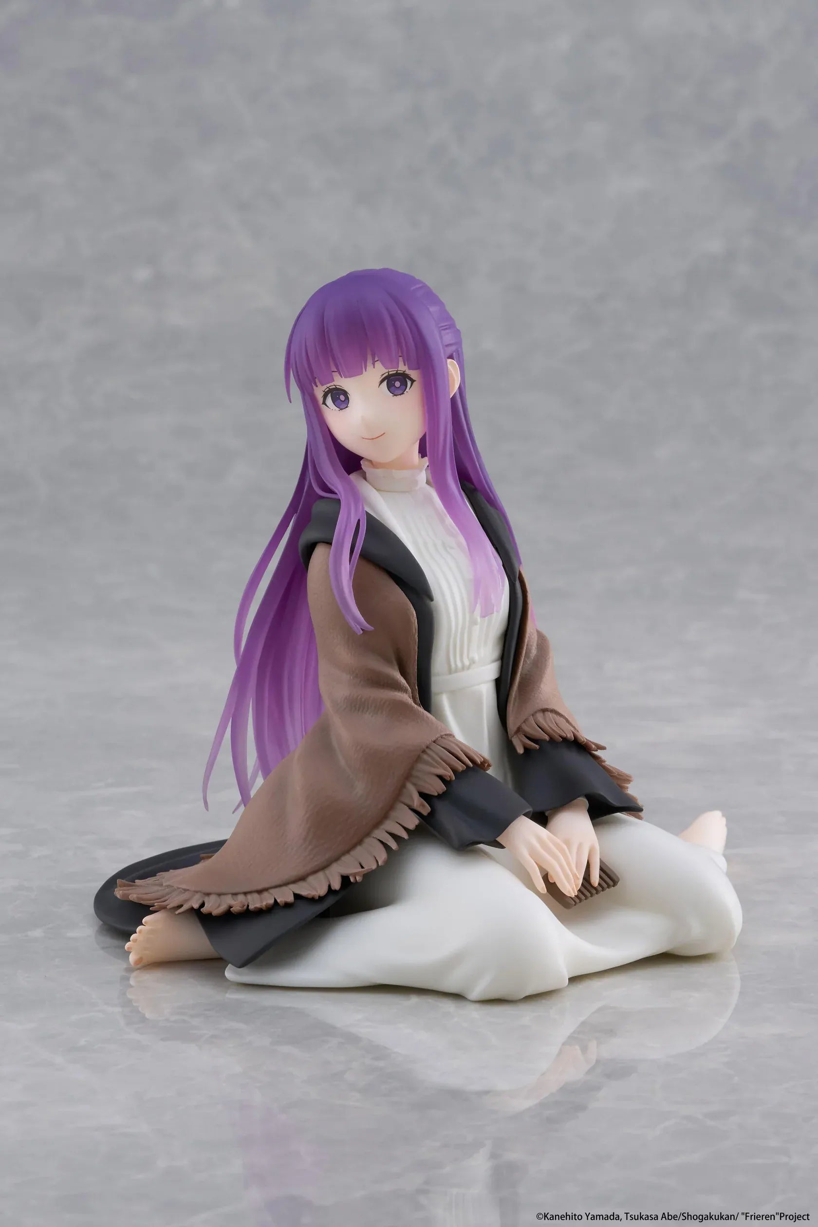 Frieren Beyond Journey's End Desktop Cute Fern Figure with purple hair wearing a shawl and white dress in a seated pose