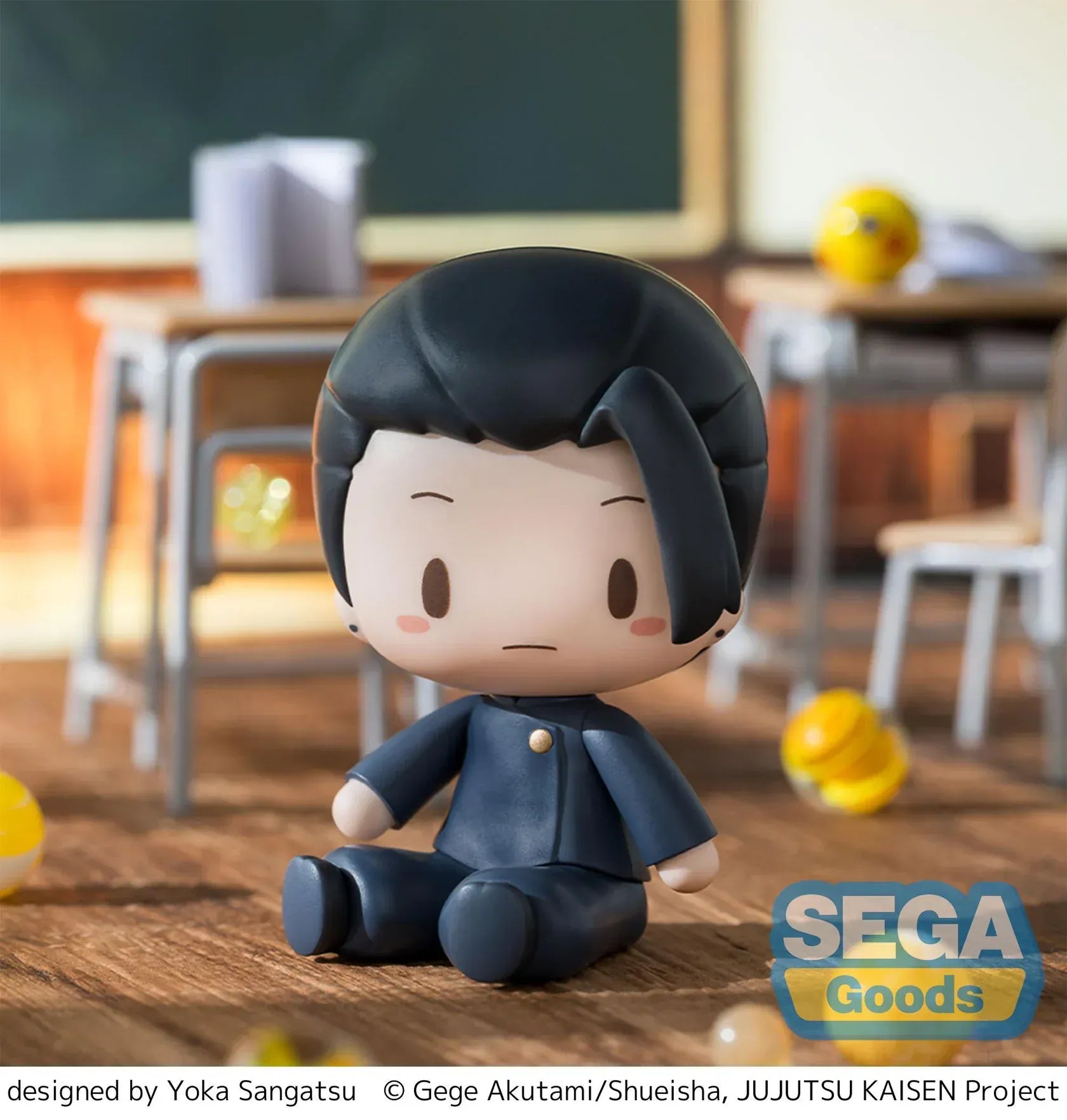 Chibi Suguru Geto Fuwa Petit figure sitting on a wooden floor in a classroom scene from Jujutsu Kaisen.