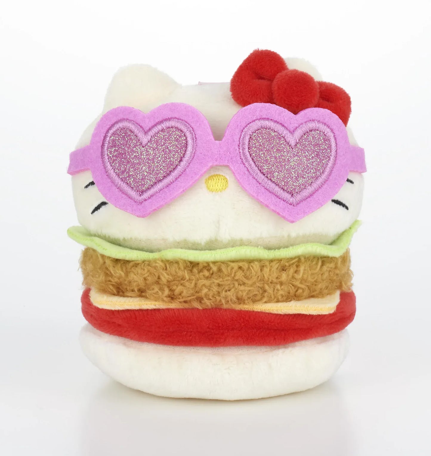 Kawaii YumYum MART DINER Hello Kitty Chicken Burger plushie featuring colorful burger layers, a red bow, and sparkly pink heart-shaped sunglasses.