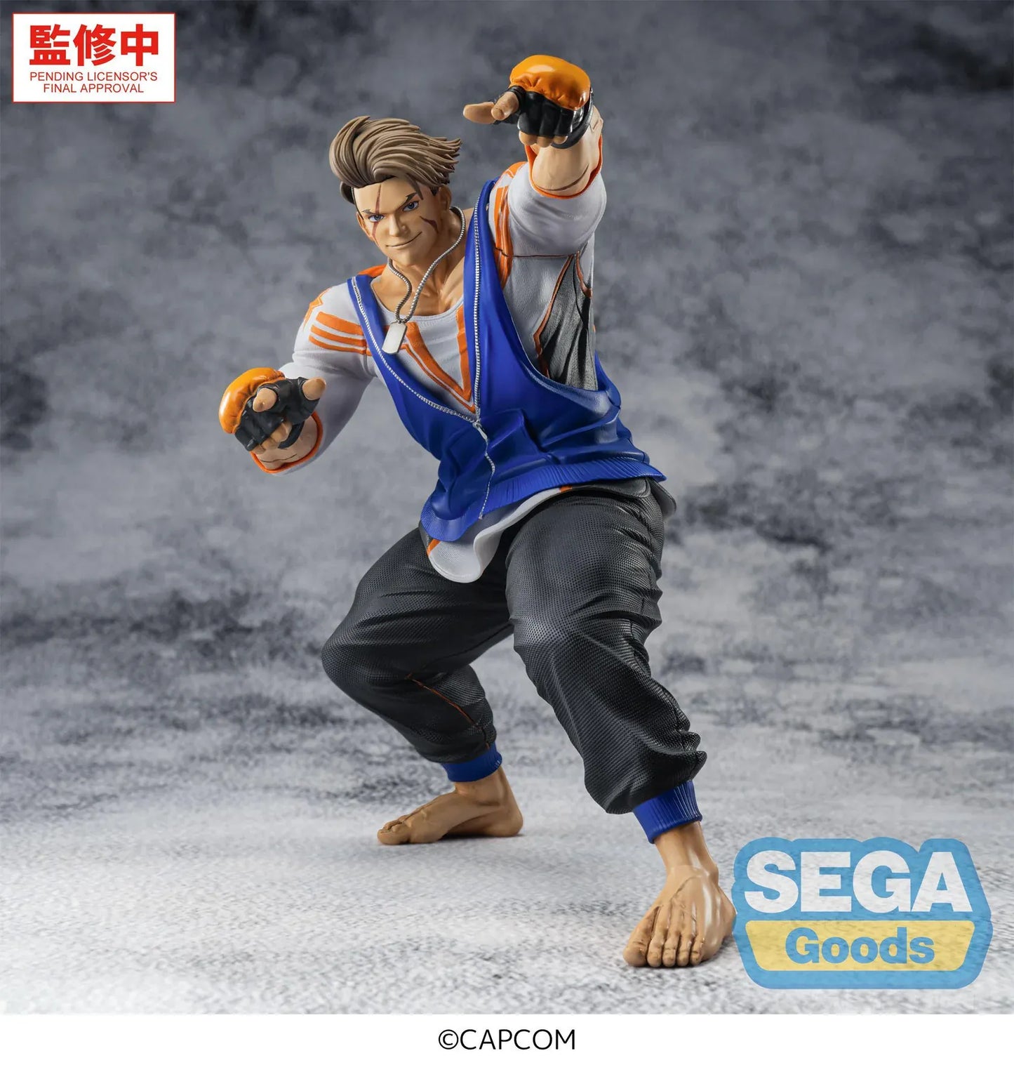 Street Fighter 6 FiGURiZMa Luke Figure in a dynamic fighting stance with blue and orange outfit and fingerless gloves