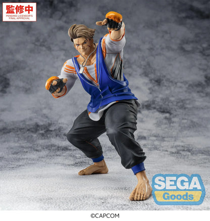Street Fighter 6 FiGURiZMa Luke Figure in a dynamic fighting stance with blue and orange outfit and fingerless gloves