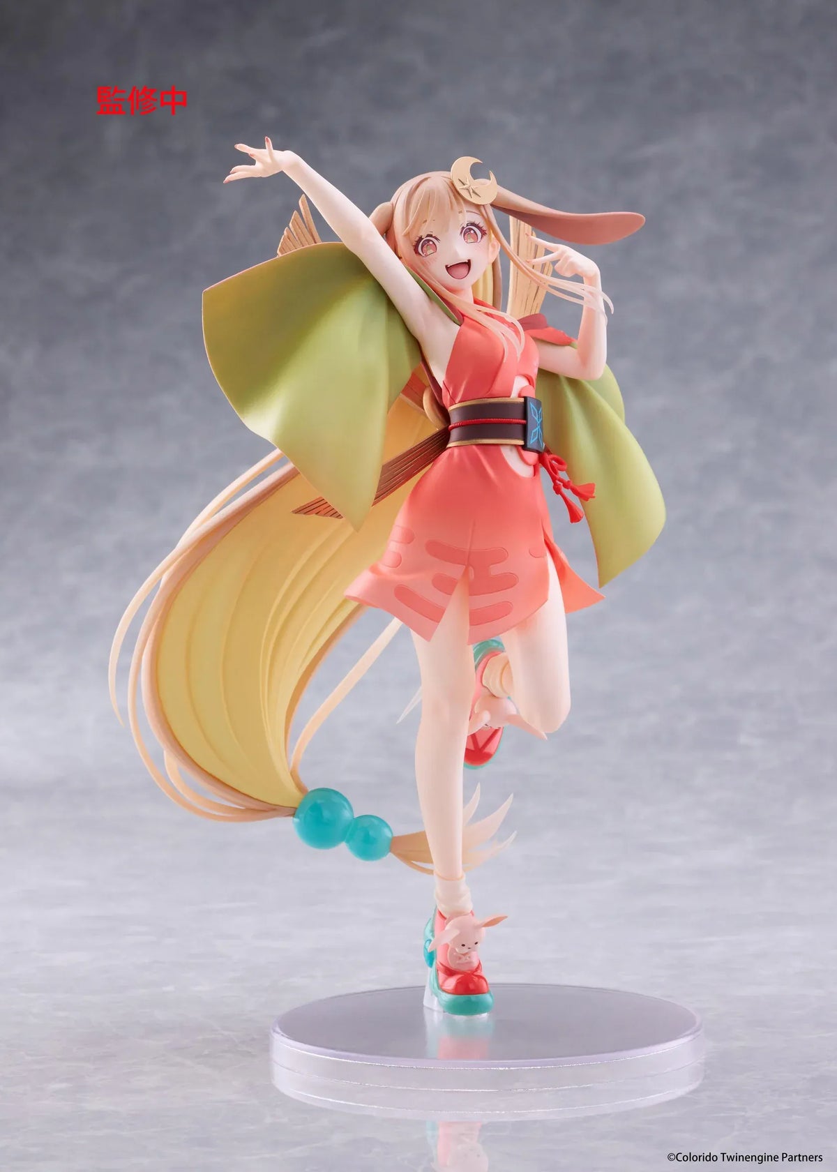 Cosmic Princess Kaguya! Kaguya VR Ver. Coreful Figure featuring a blonde-haired anime girl with pink eyes, long flowing hair, bunny ears, a crescent moon hair accessory, a coral-pink outfit with green sleeves, and colorful shoes in an energetic pose on a transparent circular base.