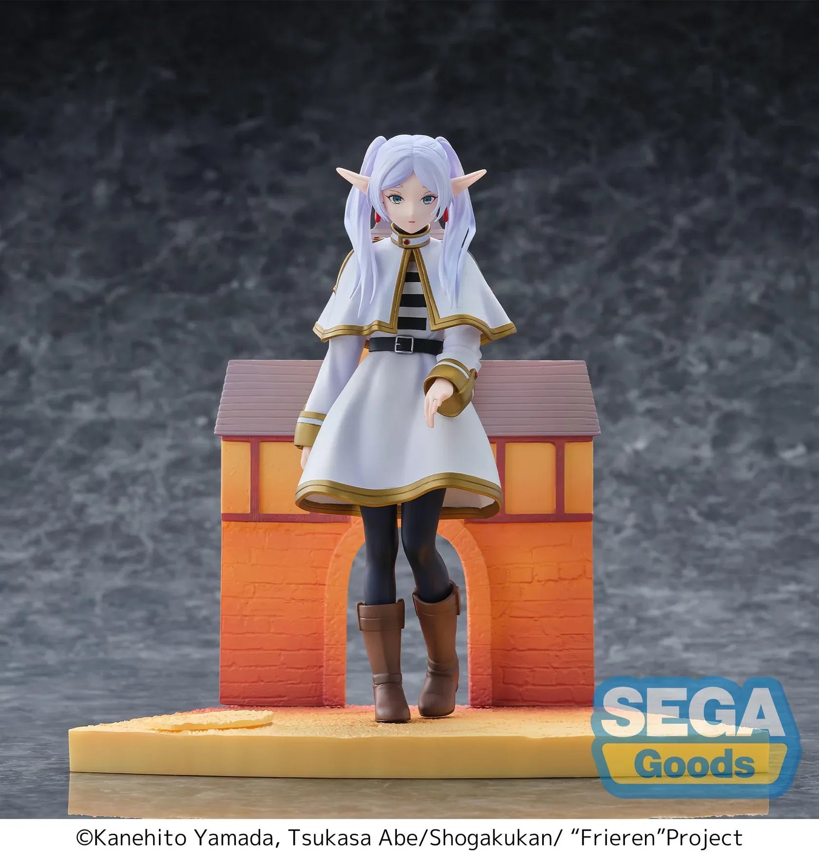 Frieren Beyond Journey's End Luminasta Frieren Eternal Love Figure with white and gold outfit and scenic building backdrop