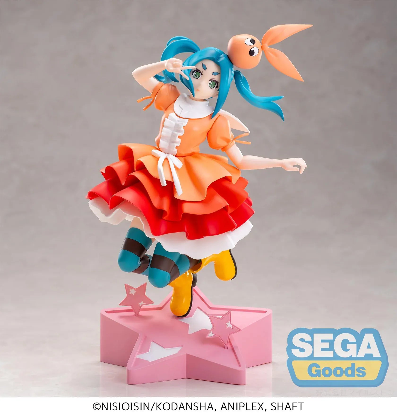 Monogatari XStellar Yotsugi Ononoki Figure with blue-green hair, orange and red outfit, and pink star display base