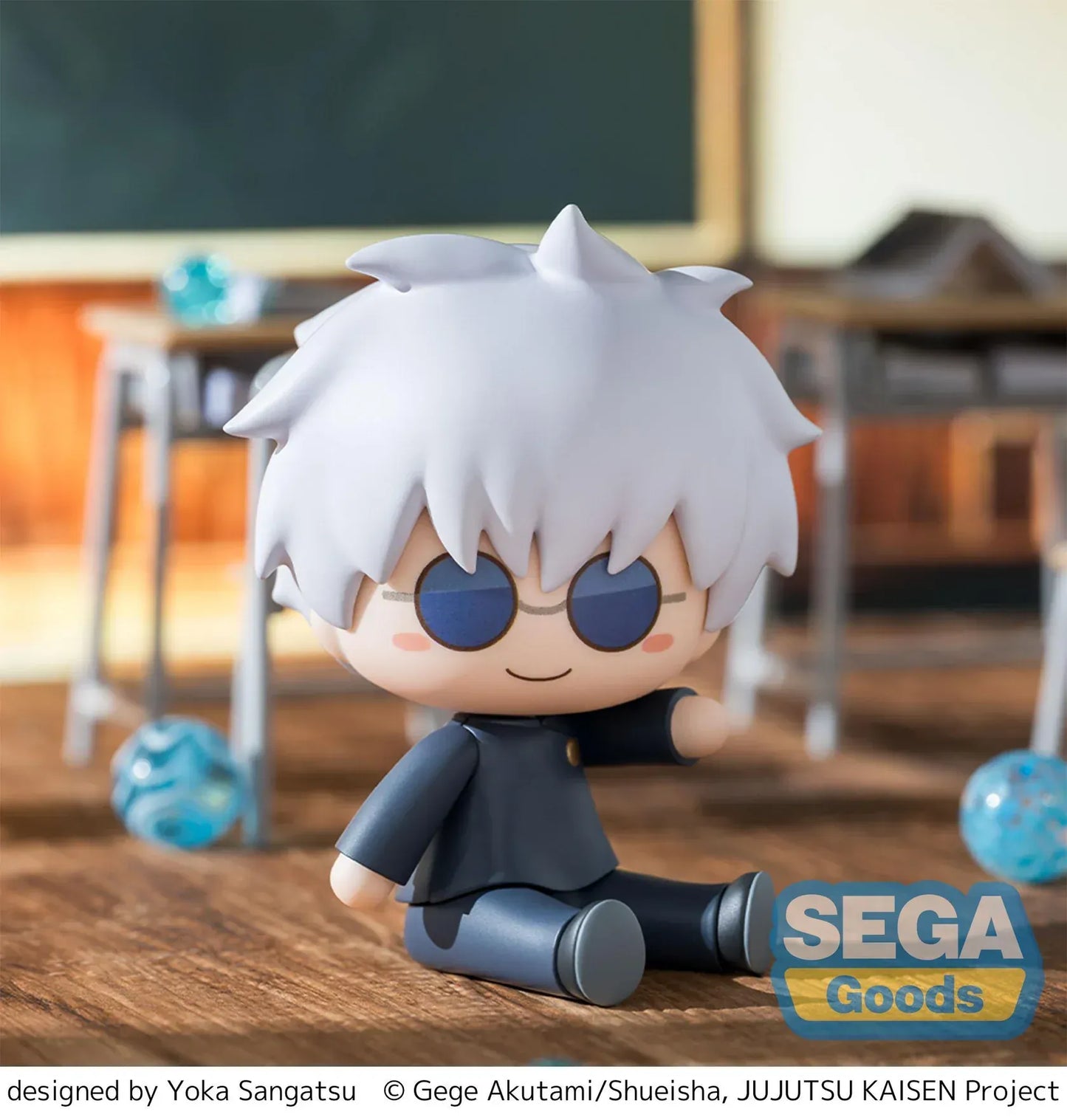 Chibi Satoru Gojo Fuwa Petit figure sitting on the floor with blue glasses and fluffy white hair from Jujutsu Kaisen.