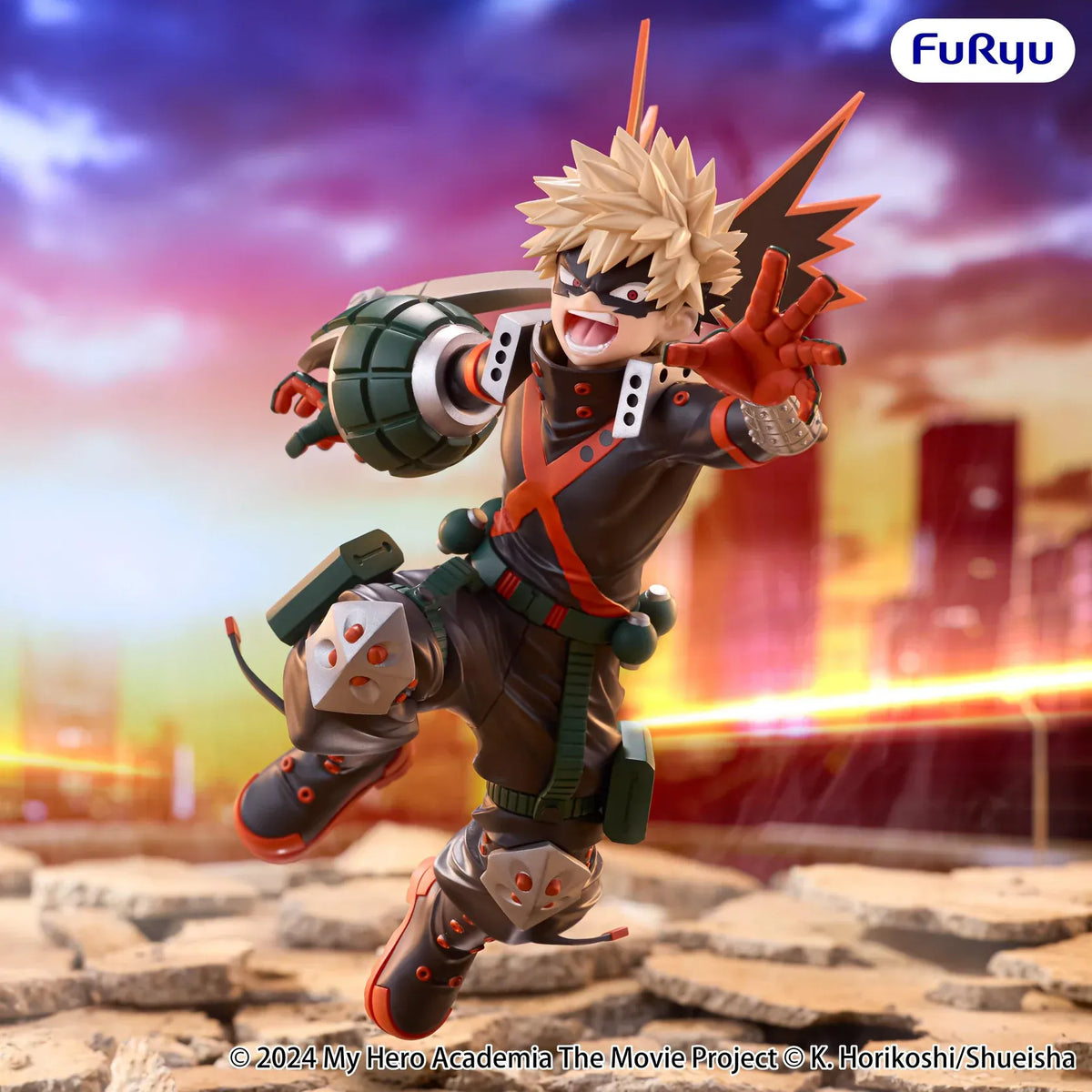 Katsuki Bakugo Muchute figure in his hero costume performing a dynamic airborne attack pose with grenade-shaped gauntlets.