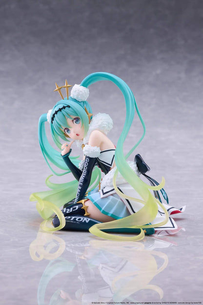 Racing Miku 2018 Ver. Round 8 figure seated in a white, black, and turquoise racing outfit with long gradient twin tails.