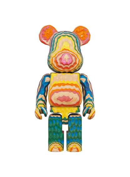BE@RBRICK Karimoku fragmentdesign HAROSHI VERTICAL 400% wooden figure with multicolored contour patterns, blue arms, green legs, and natural wood tones.
