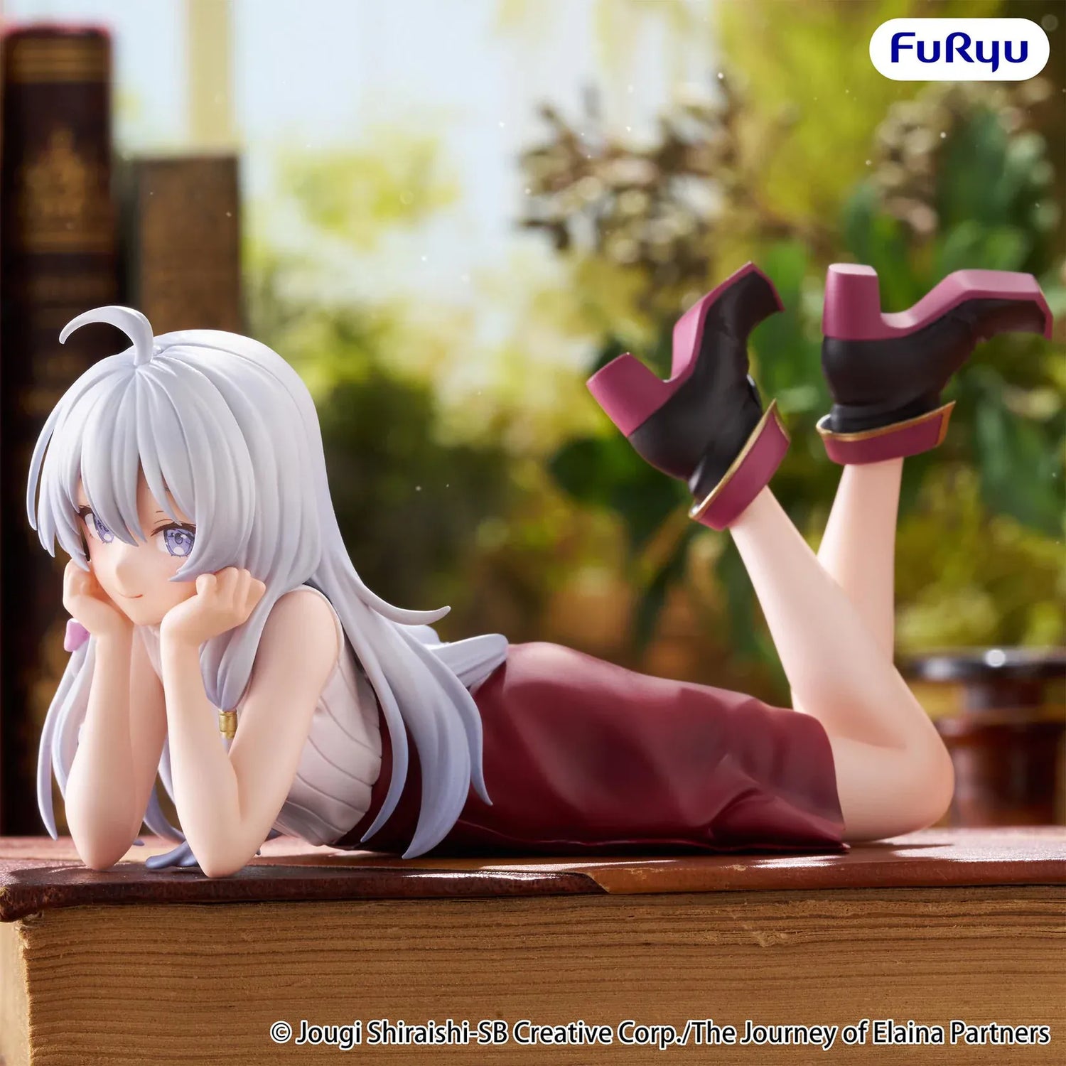 The Journey of Elaina Noodle Stopper Elaina Lying Down Ver. figure featuring silver hair, a relaxed lying pose, and an elegant outfit