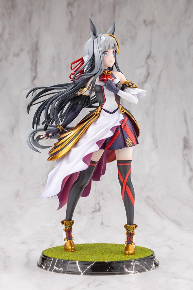 Umamusume Pretty Derby Chrono Genesis 1/7 Scale Figure featuring a silver-gray-haired horse girl with blue eyes, horse ears, and a flowing white, black, red, and gold racing outfit standing on a grassy display base.