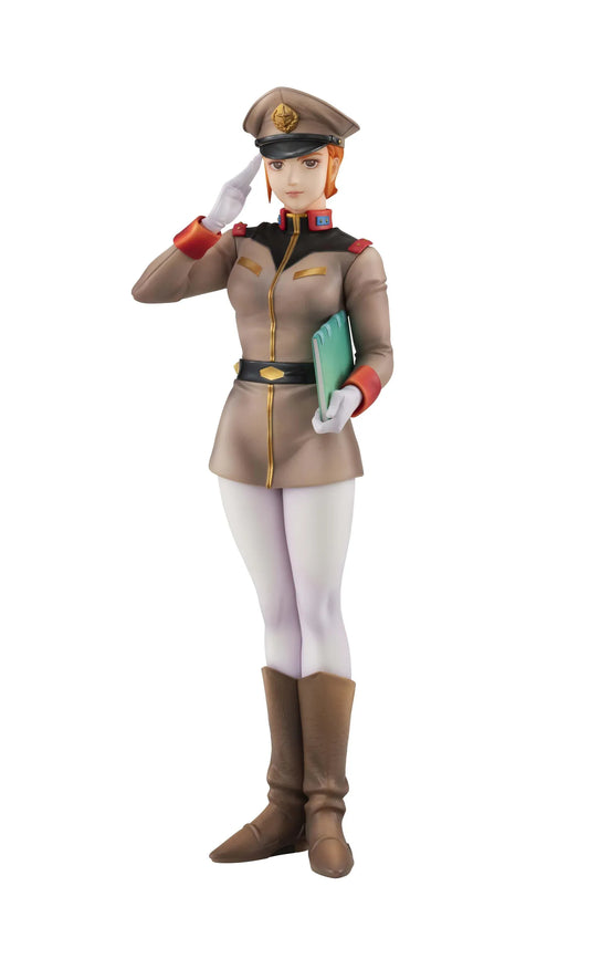 Gundam Girls Generation Matilda Ajan figure saluting in a tan military uniform and peaked cap, holding a green folder, with white trousers and brown boots.