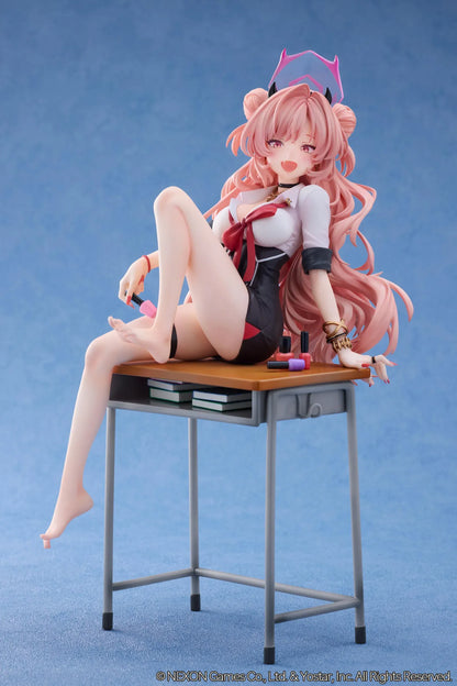 Blue Archive Kirara figure with long pink hair, black horns, and a pink halo, seated on a classroom desk beside nail polish bottles.