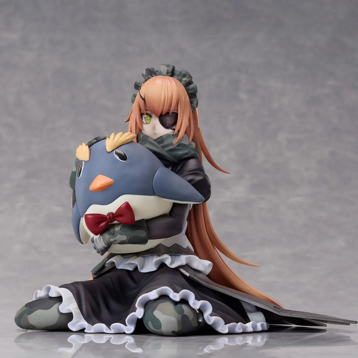 Overlord CZ2128 Delta 1/6 scale figure wearing her camouflage maid uniform and eyepatch while seated with a large penguin plush.