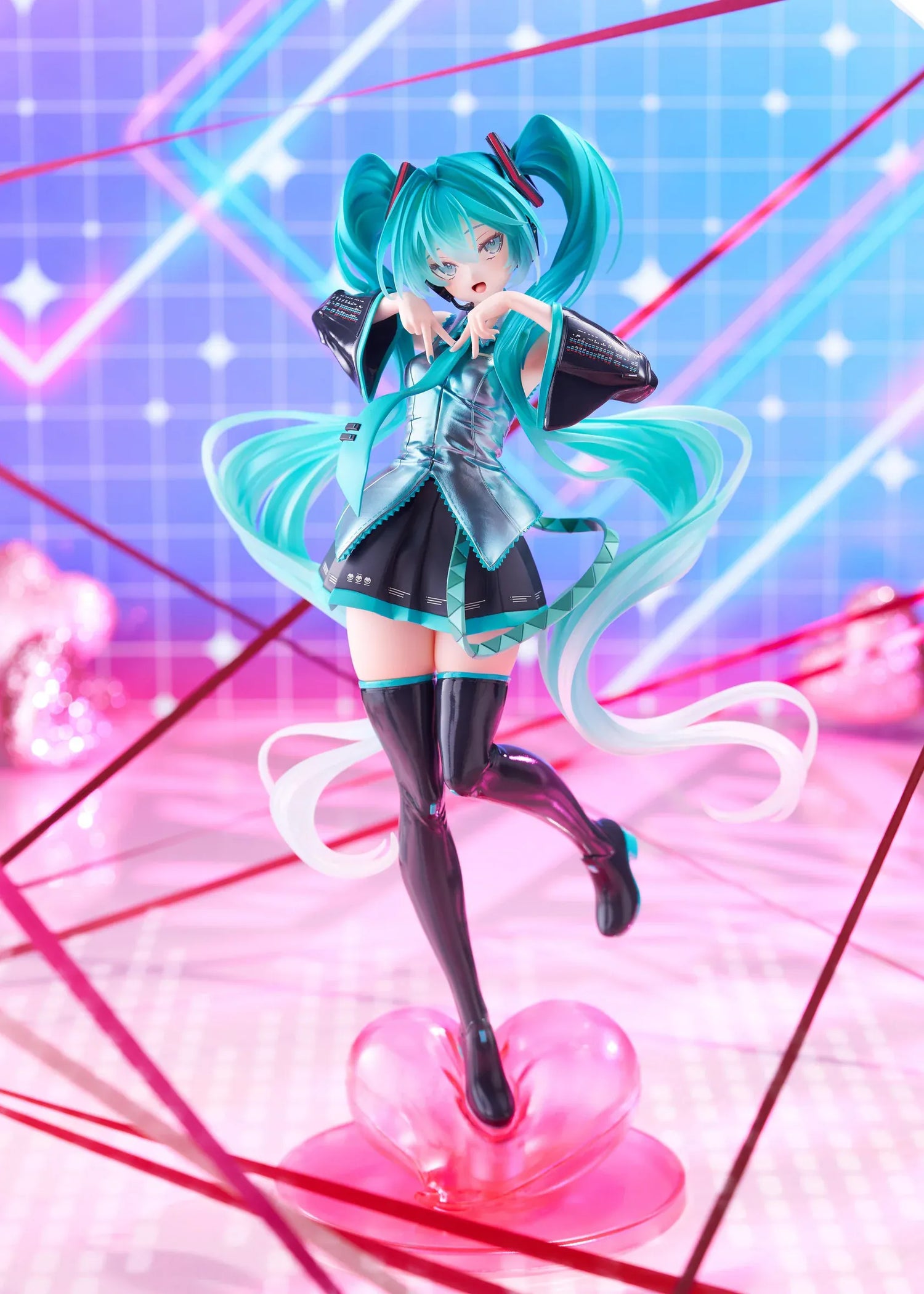 Hatsune Miku T-Most figure with flowing twin tails, classic Vocaloid outfit, and pink heart-shaped display base