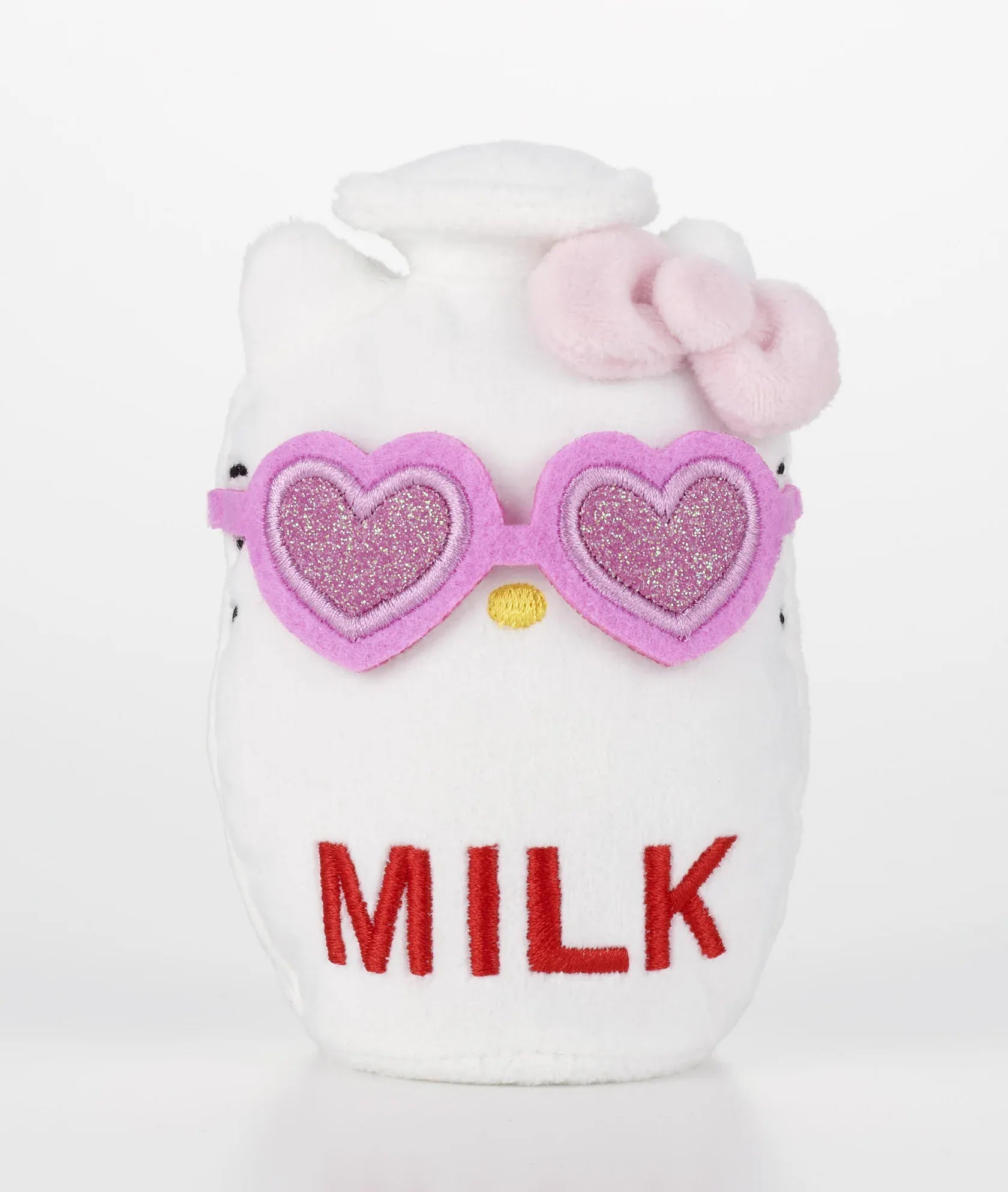 Kawaii YumYum MART DINER Hello Kitty Milk plushie shaped like a white milk bottle with red lettering, a pink bow, and sparkly heart-shaped sunglasses.