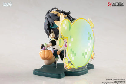 Genshin Impact You Ye Qi Xiang Series chibi Kinich figure holding a lollipop, surrounded by candy, a pumpkin, and a pixel-art backdrop.