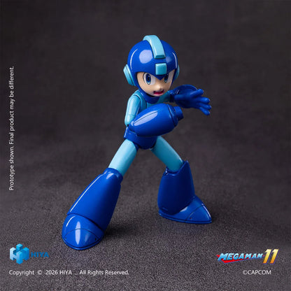 Mega Man Original Series action figure by Hiya Toys with interchangeable faces, hands, Mega Buster, charged-shot effect, and clear display stand.