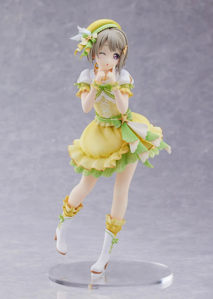 Love Live Nijigasaki High School Idol Club Kasumi Nakasu 1/7 Scale Figure featuring Kasumi in a yellow and green idol outfit with a winking expression, ribbon accents, and matching boots.