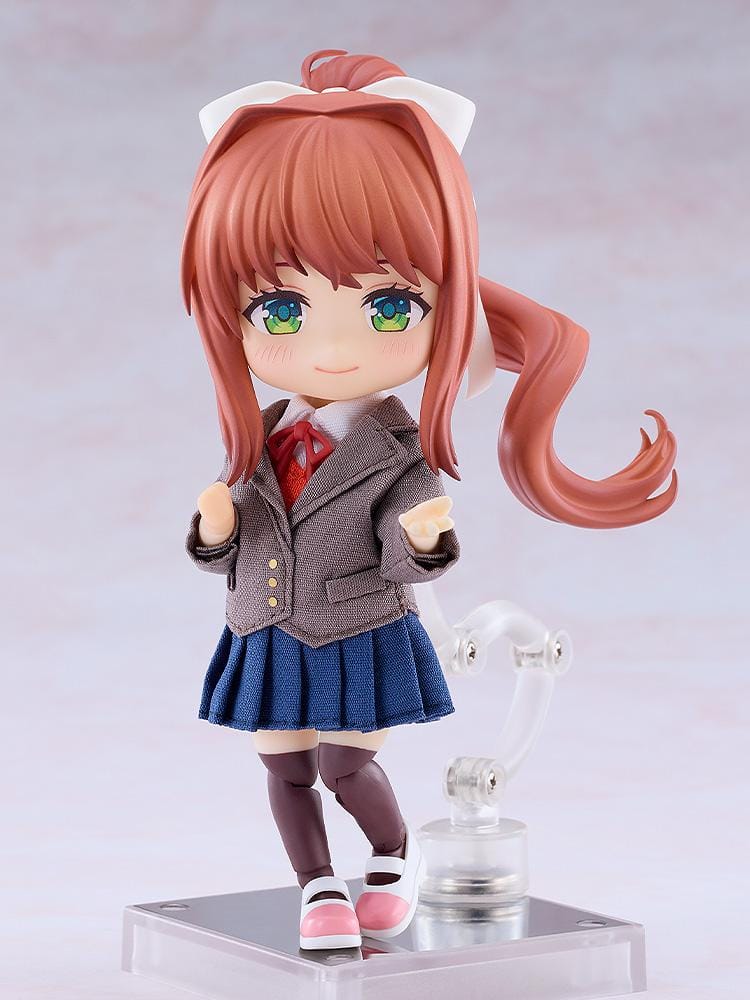 Doki Doki Literature Club! Nendoroid Doll Monika wearing a fabric brown blazer, blue pleated skirt, red ribbon, and white hair bow.