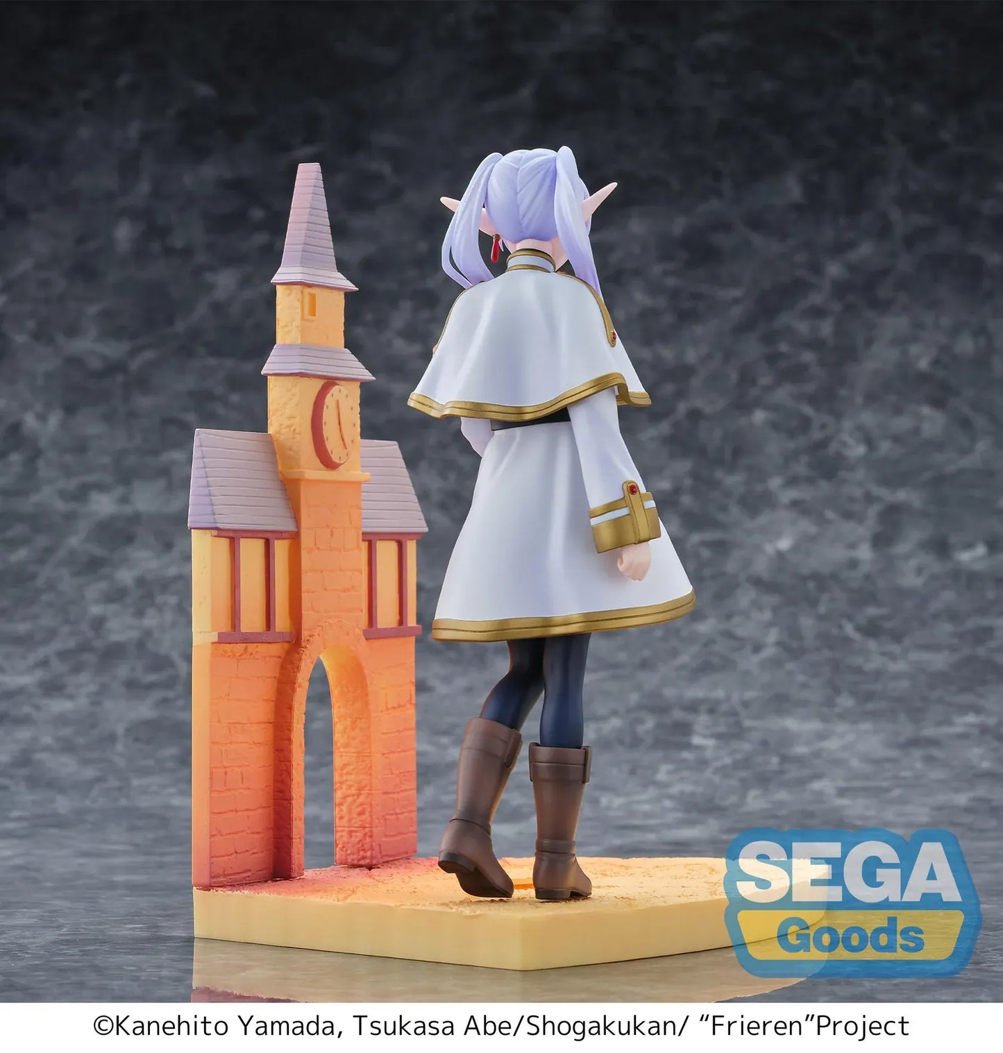 Frieren Beyond Journey's End Luminasta Frieren Eternal Love Figure with white and gold outfit and scenic building backdrop