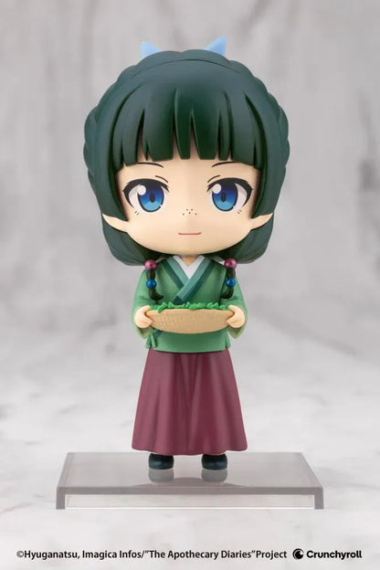 The Apothecary Diaries Oshi Works Mini Maomao Figure wearing a green outfit and holding a basket