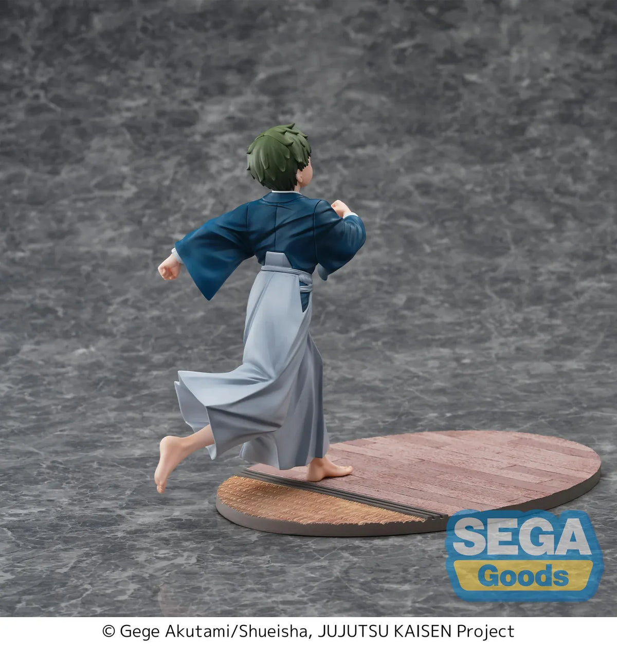 Luminasta Naoya Zen’in Childhood figure running barefoot in a blue top and gray hakama, smiling on an oval base with wood-style flooring.