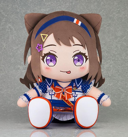 BanG Dream! Kasumi Toyama plush seated in a blue and white stage outfit with an orange bow, brown hair, purple eyes, and decorative hair clips.