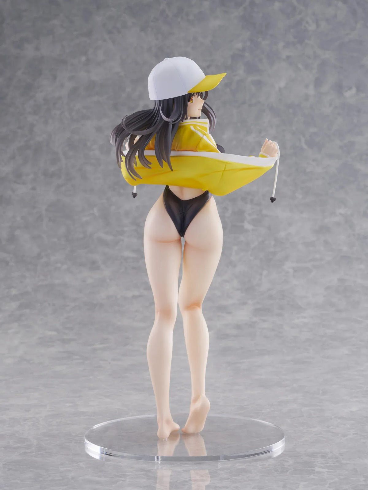 KoiKoi Sakura Kyou kara Suieibu Komon no Tama-chan Sensei 1/6 Scale Figure featuring a dark-haired anime woman with golden eyes wearing a black swimsuit, yellow athletic jacket, and white cap with a yellow brim, posing barefoot on a transparent circular base.