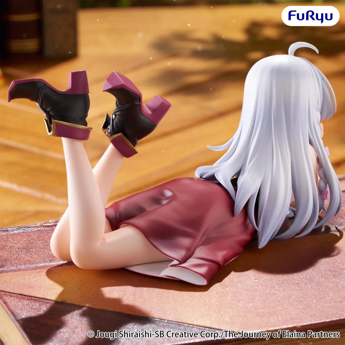 The Journey of Elaina Noodle Stopper Elaina Lying Down Ver. figure featuring silver hair, a relaxed lying pose, and an elegant outfit