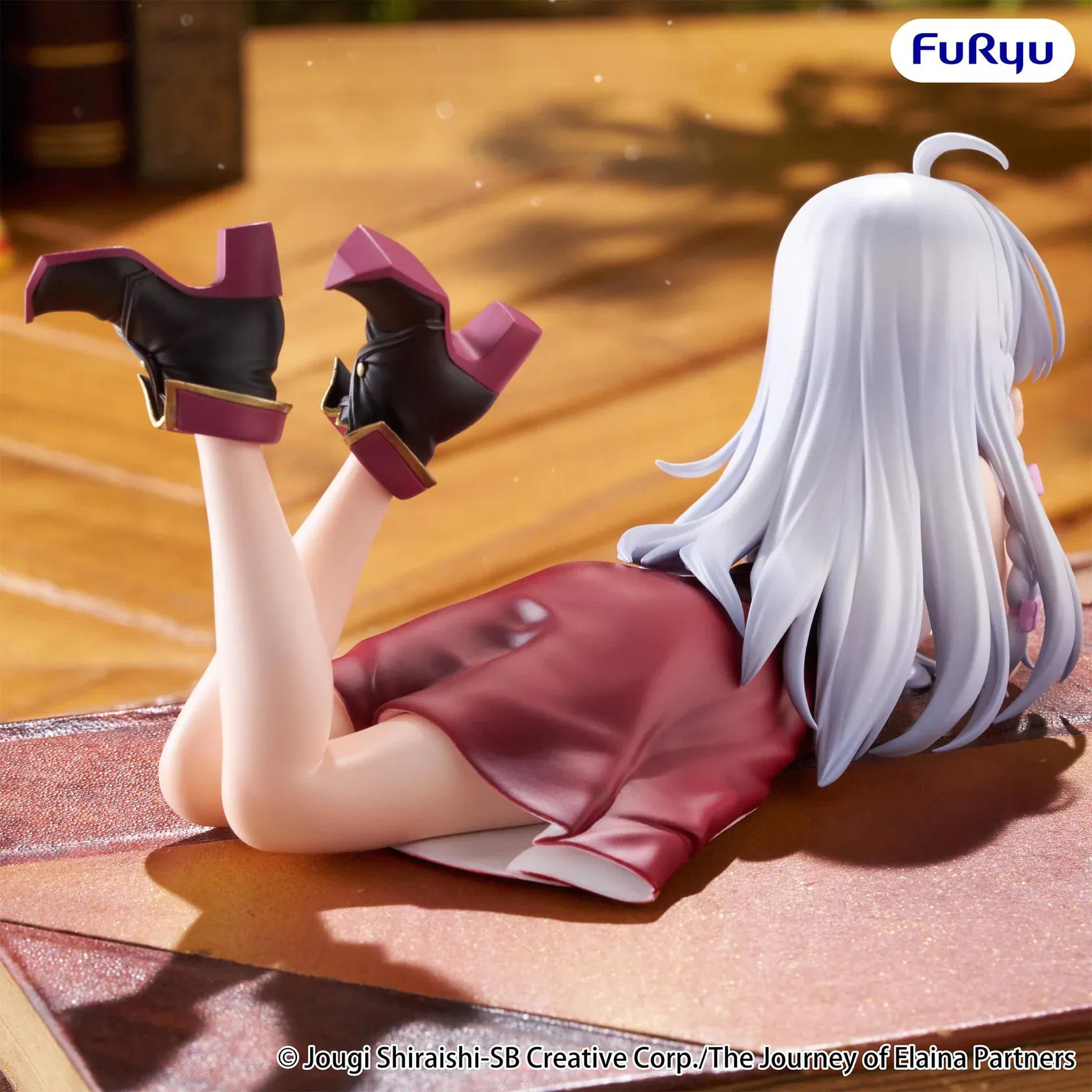 The Journey of Elaina Noodle Stopper Elaina Lying Down Ver. figure featuring silver hair, a relaxed lying pose, and an elegant outfit