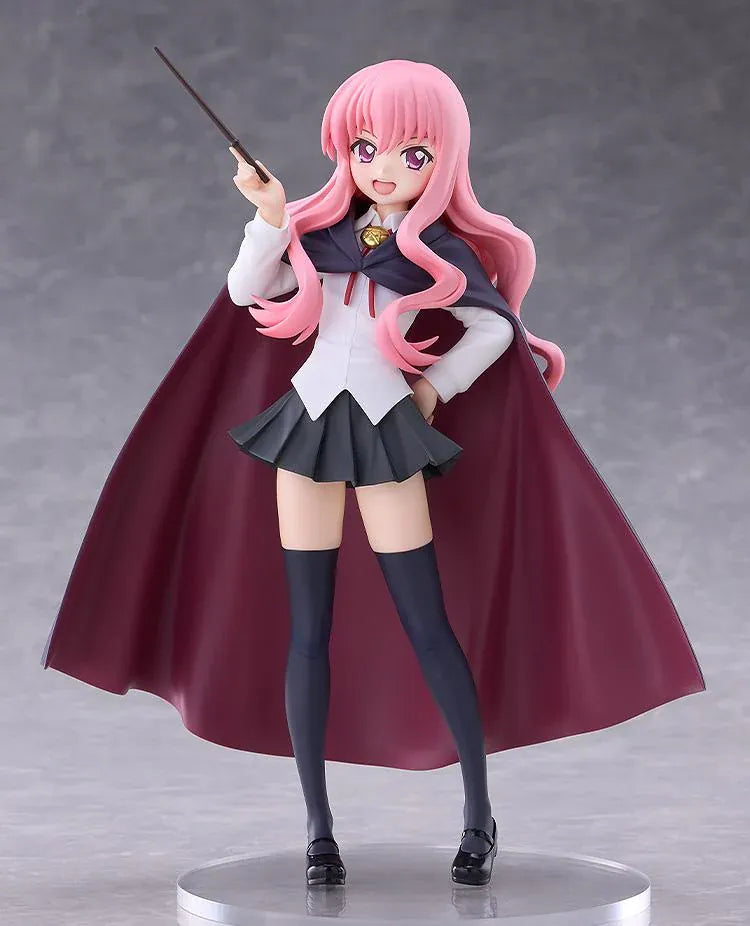 POP UP PARADE Louise L Size figure with flowing pink hair, a raised wand, white blouse, dark skirt, and a cape with burgundy lining.