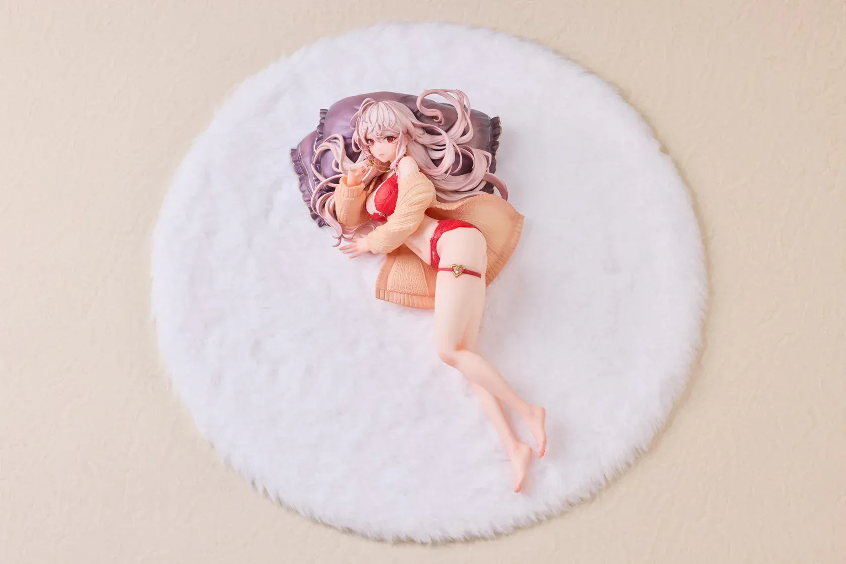 Makia 1/7 scale figure lying on a large fluffy white round base, wearing a cardigan and red lingerie, resting on a purple pillow