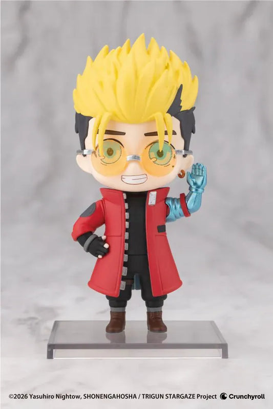 TRIGUN STARGAZE Oshi Works Mini Vash the Stampede figure with blond hair, amber glasses, red coat, toothy grin, and raised mechanical arm.