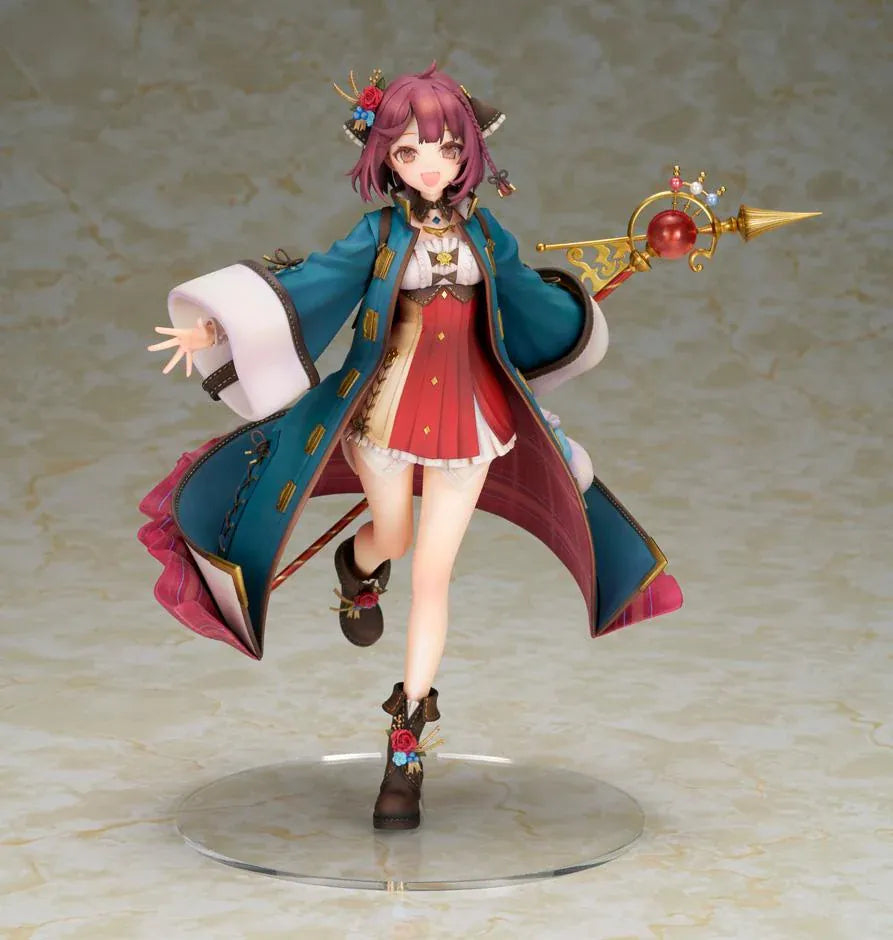 Sophie Neuenmuller figure smiling in a dynamic pose, wearing a teal coat over a red outfit and holding an ornate gold staff with a red orb.