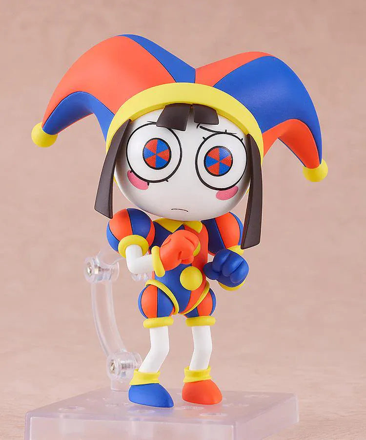 The Amazing Digital Circus Nendoroid Pomni Figure Rerelease featuring Pomni in a colorful red, blue, and yellow jester outfit with oversized hat and mismatched shoes.