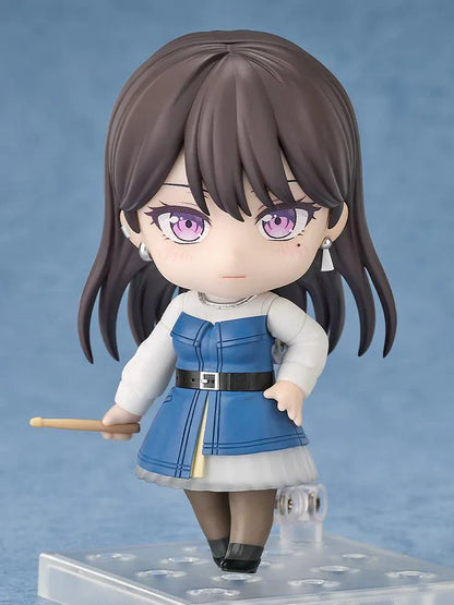 BanG Dream Nendoroid Taki Shiina Figure featuring Taki in a chibi-style design with long dark hair, purple eyes, blue outfit, and drumstick accessory.