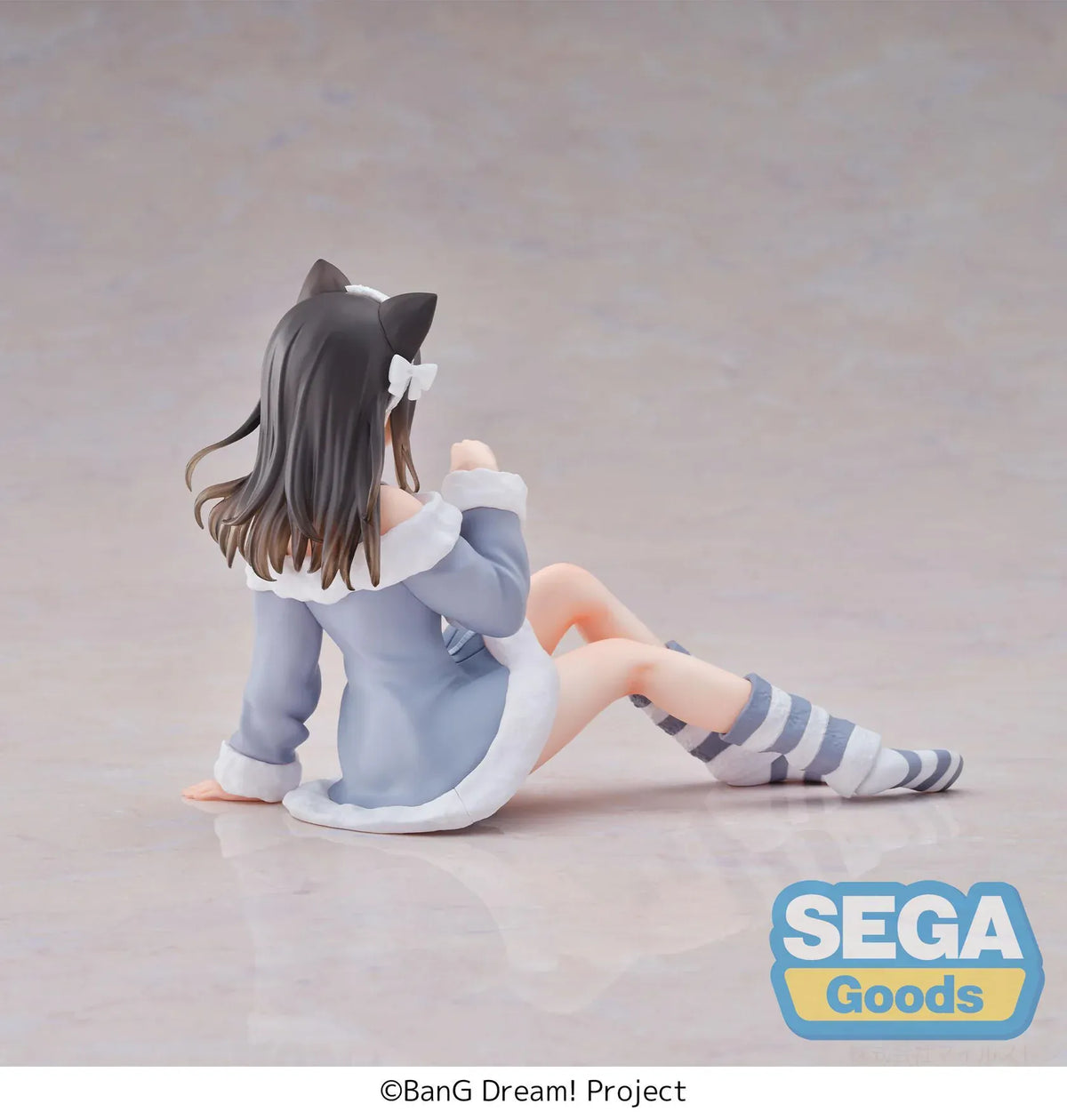 BanG Dream! Mana Sumita Pajama Party figure seated in a blue-gray outfit with white trim, cat-ear headband, striped socks, and one hand raised.