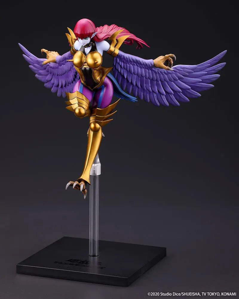 Harpie Lady figure posed in flight with outstretched purple wings, red hair, and gold Cyber Shield armor above a black display base.