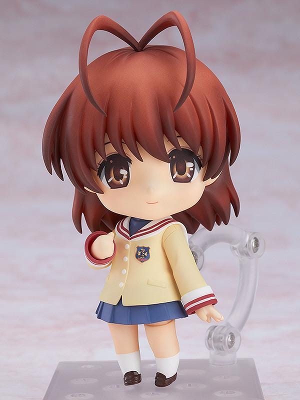 CLANNAD Nendoroid Nagisa Furukawa Figure featuring Nagisa in a chibi-style design with brown hair, cream cardigan, blue skirt, and school uniform details.
