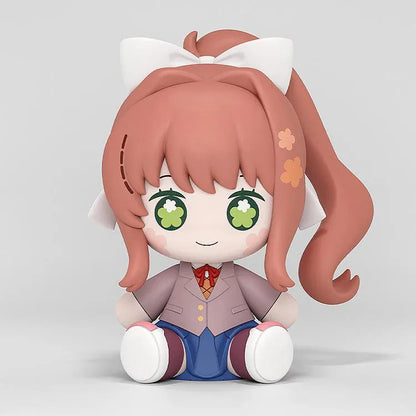 Doki Doki Literature Club! Huggy Good Smile Monika figure with green flower-filled eyes, a white hair bow, and a school uniform in a seated pose.