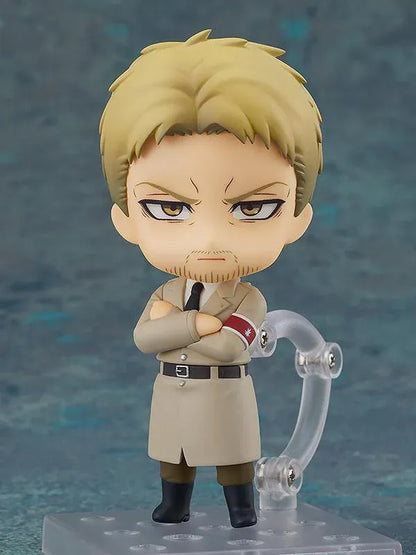 Attack on Titan Nendoroid Reiner Braun rerelease figure with blonde hair, facial stubble, crossed arms, and a tan Marleyan uniform.